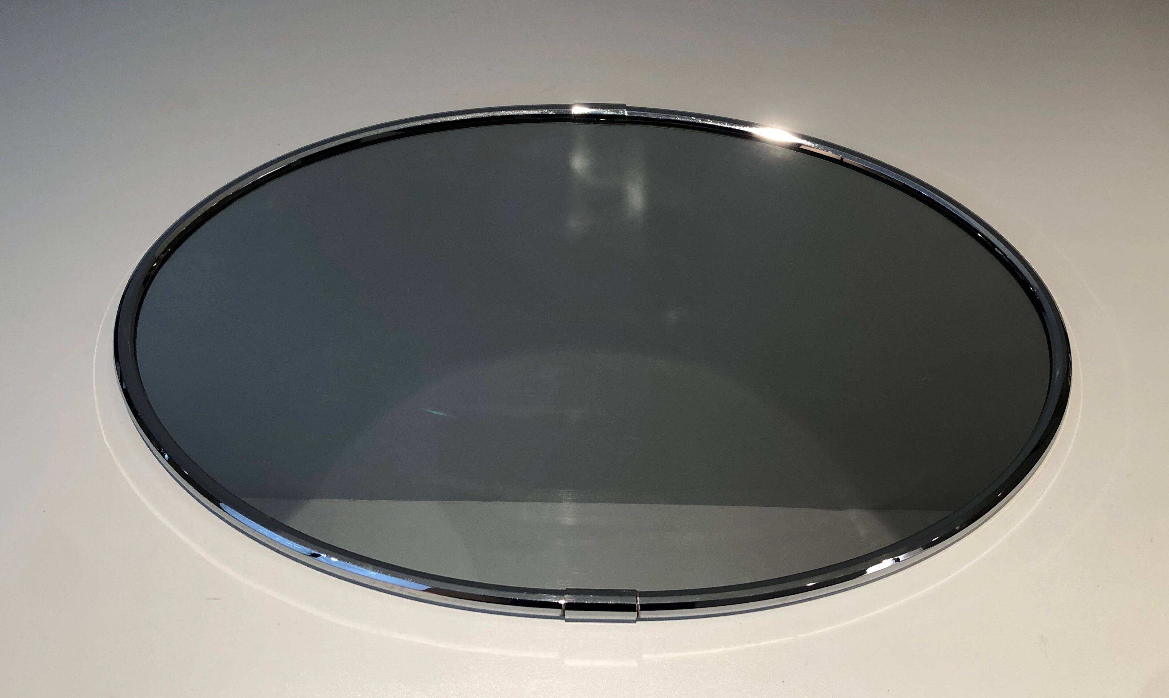 Oval chrome mirror in Art Deco style. Circa 1970.