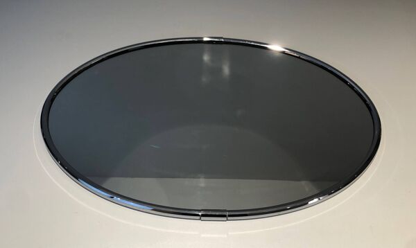 Miroir ovale chromé de style art déco. Vers 1970