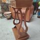 Vintage end table with lyre legs and two drawers.