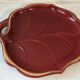 Mid-Century catchall in ruby red ceramic with gold trim – shape