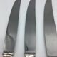 12 silver metal knives.