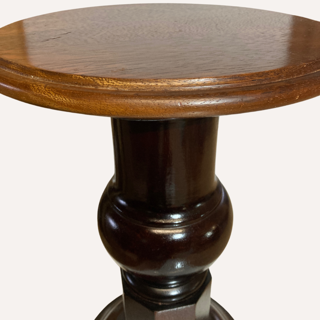 Vintage mahogany pedestal or side table with brass claw feet