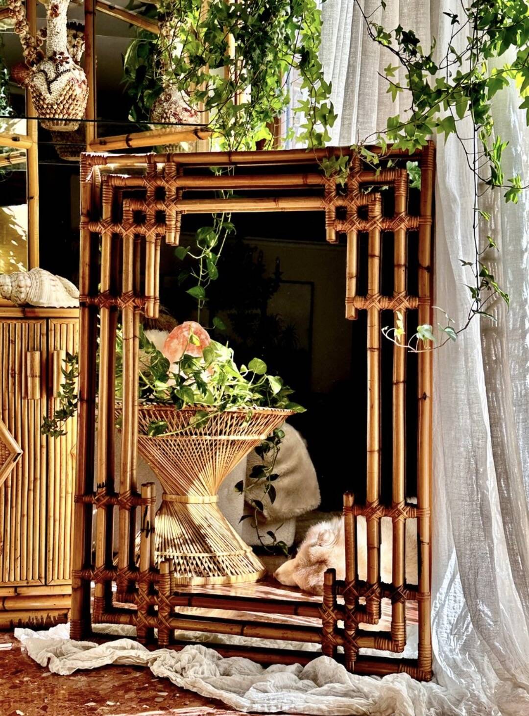Large sculptural mirror handmade from natural bamboo and woven rattan, 1960.