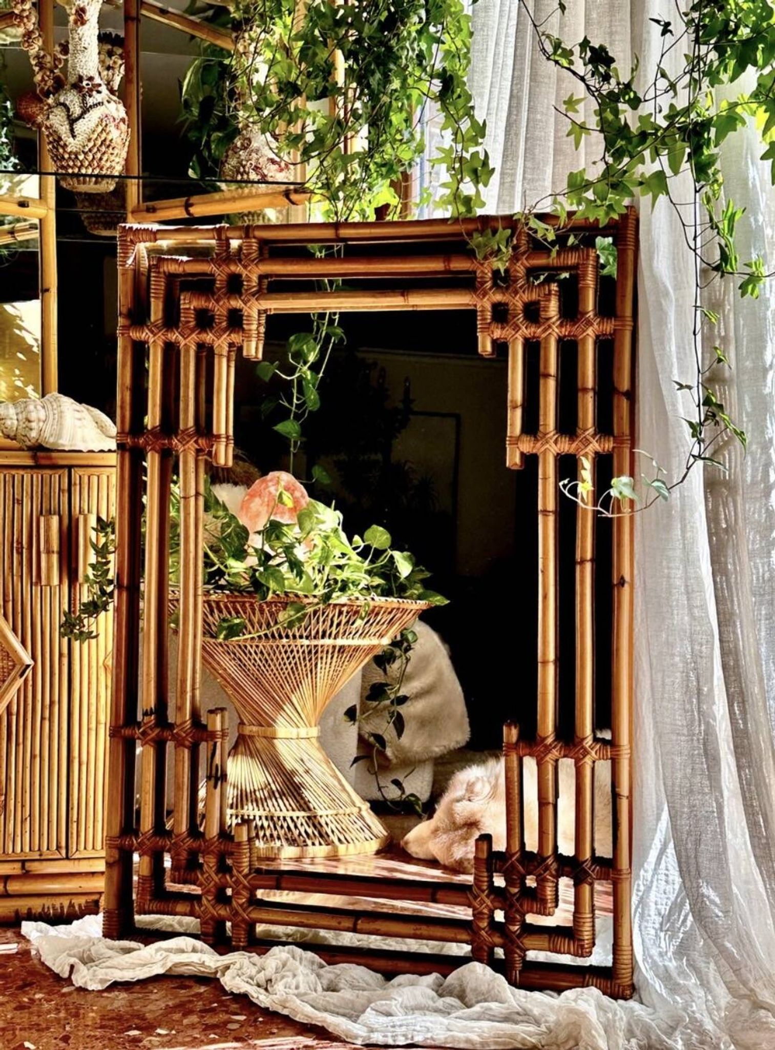 Large sculptural mirror handmade from natural bamboo and woven rattan, 1960.