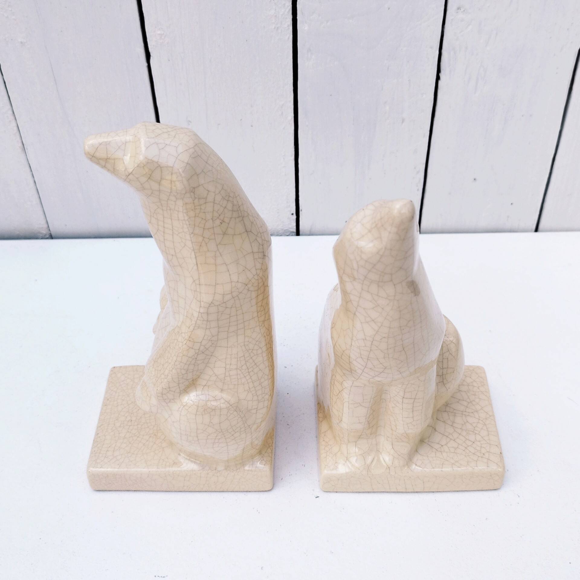 Cracked ceramic bookends with a couple of bears