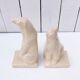 Cracked ceramic bookends with a couple of bears