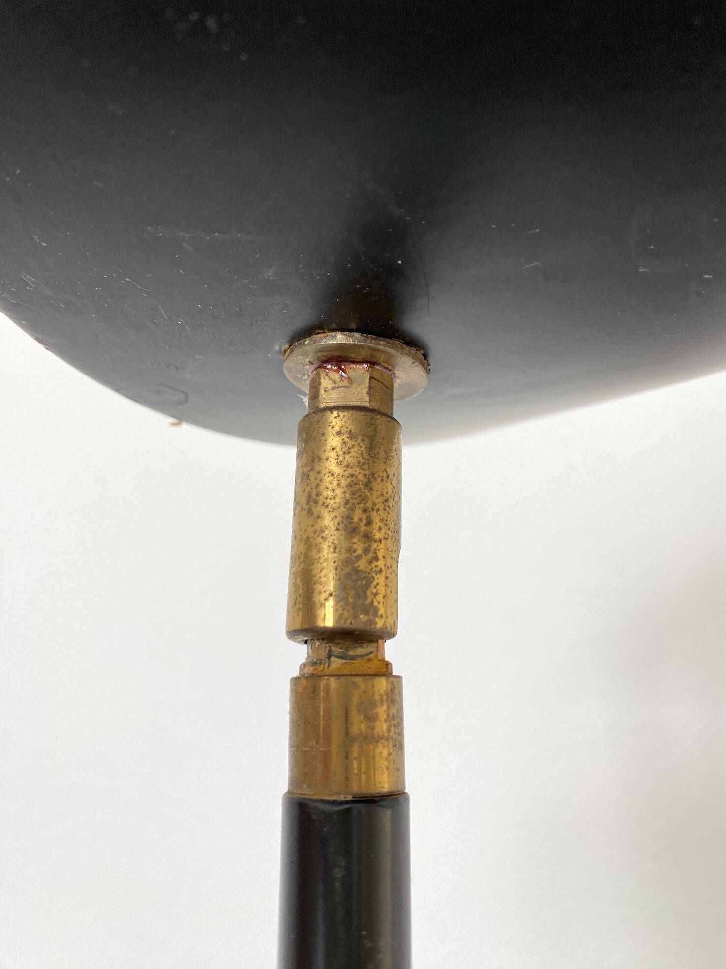 Vintage halogen floor lamp in black lacquered metal and brass ball joint