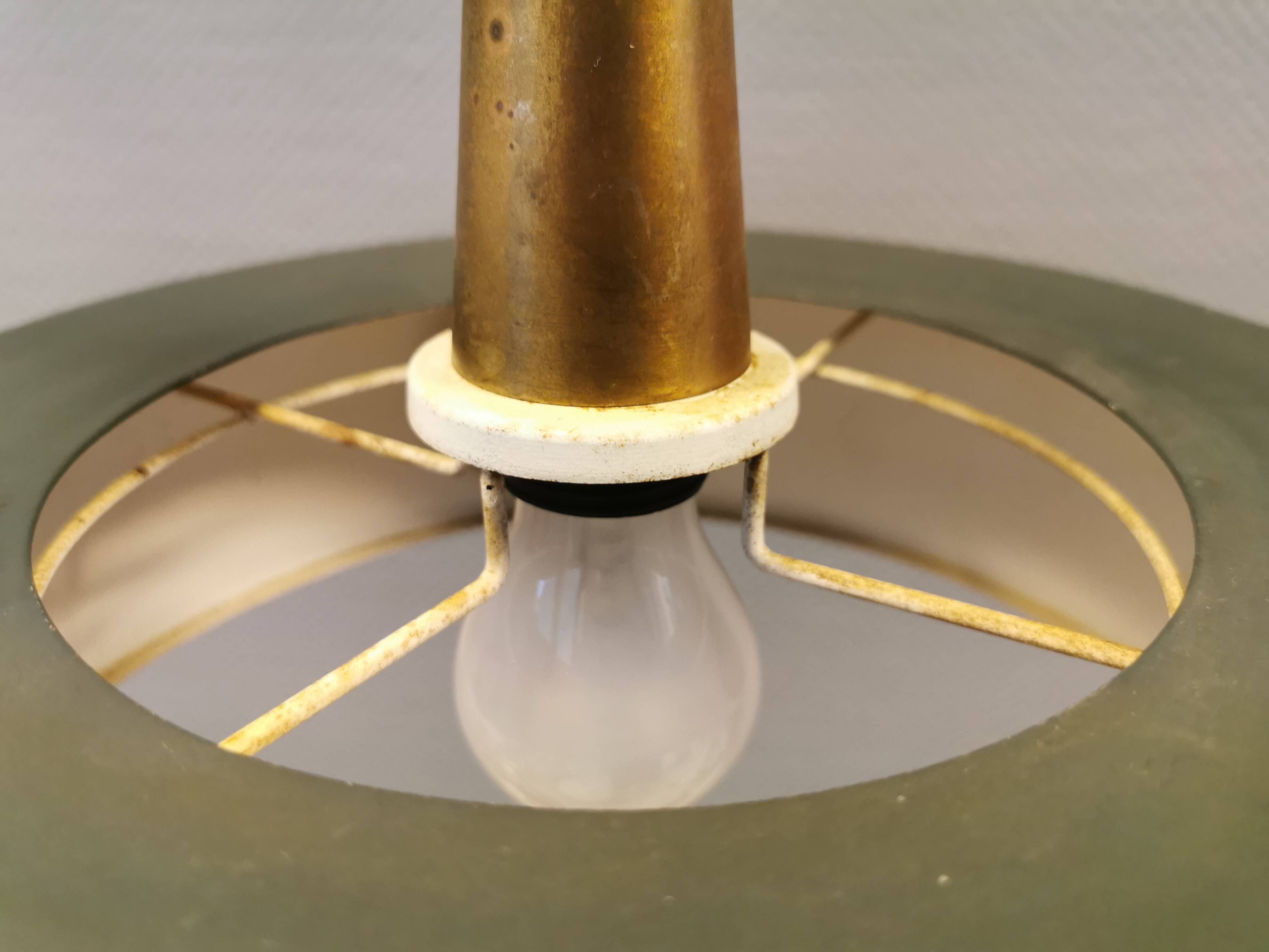 Swedish hanging lamp, in dark green lacquered metal with red glass prisms and brass top/suspension.