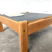 Modernist coffee table in solid pine with a reversible top, 1970s.
