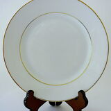 Suite of twelve table plates in white and gold porcelain.