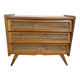 Vintage commode with tapered legs in rattan.