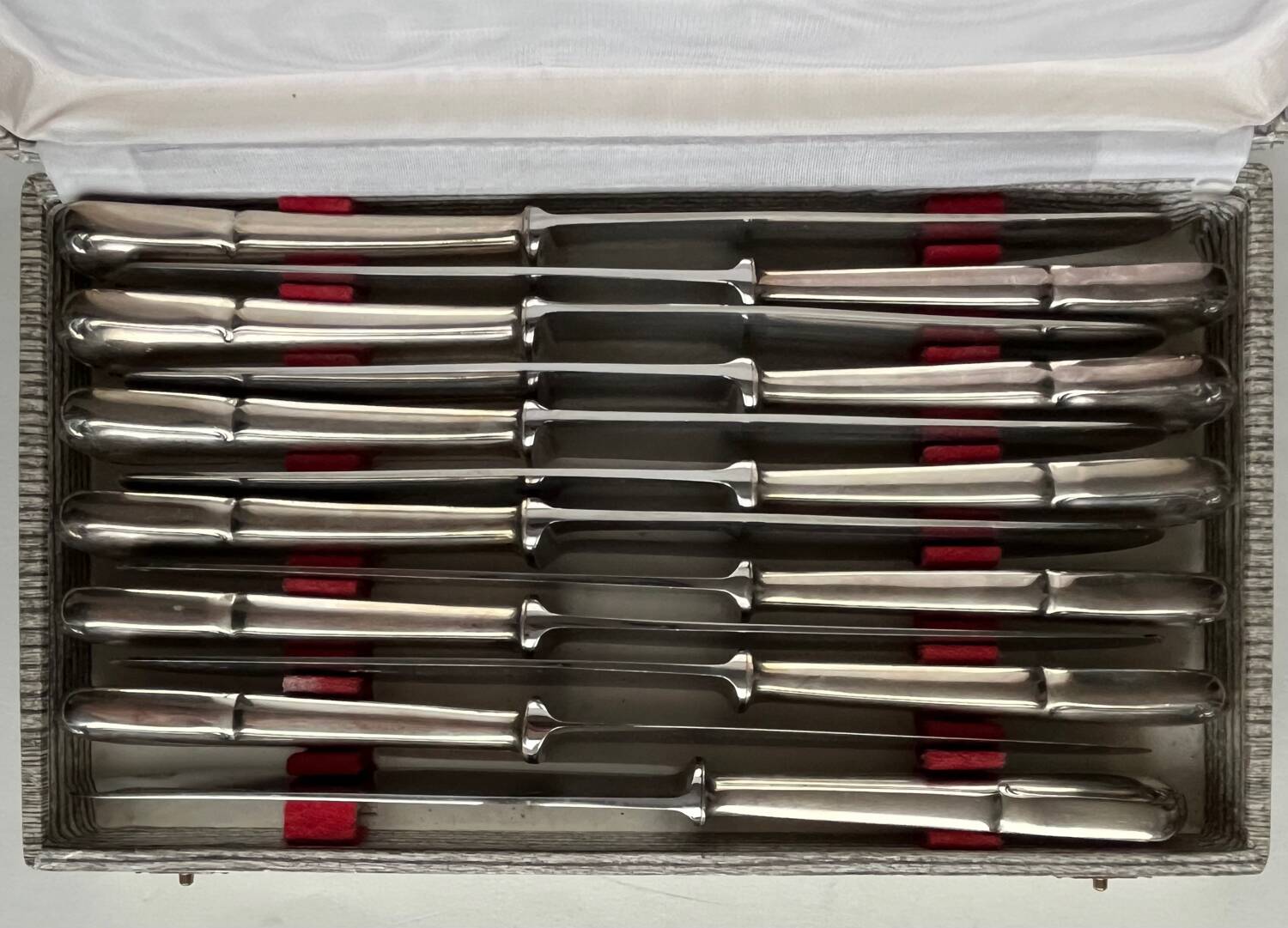 12 silver metal knives