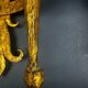 Pair of electrified golden wrought iron gothic wall sconces.
