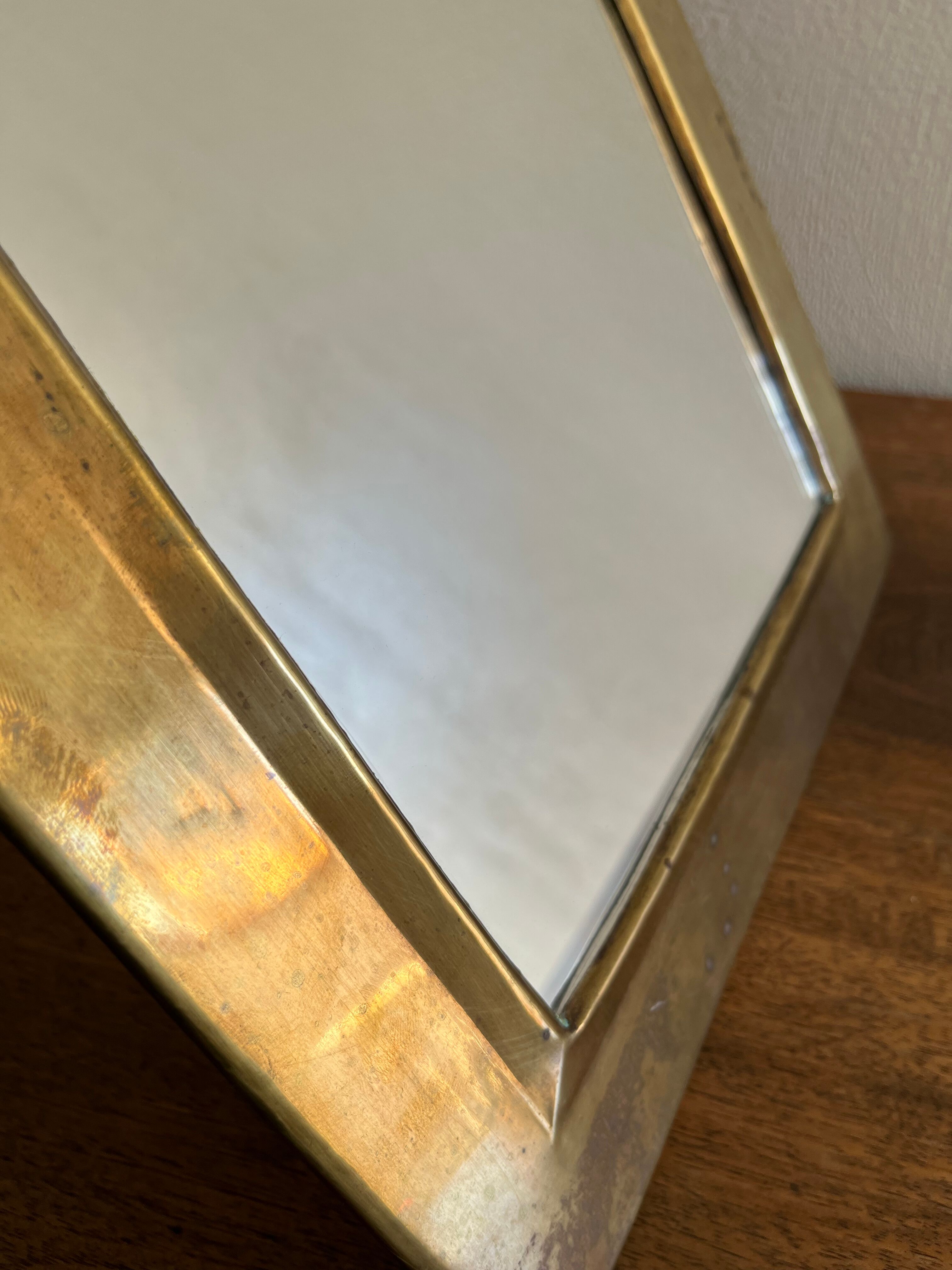 Brass half-moon mirror