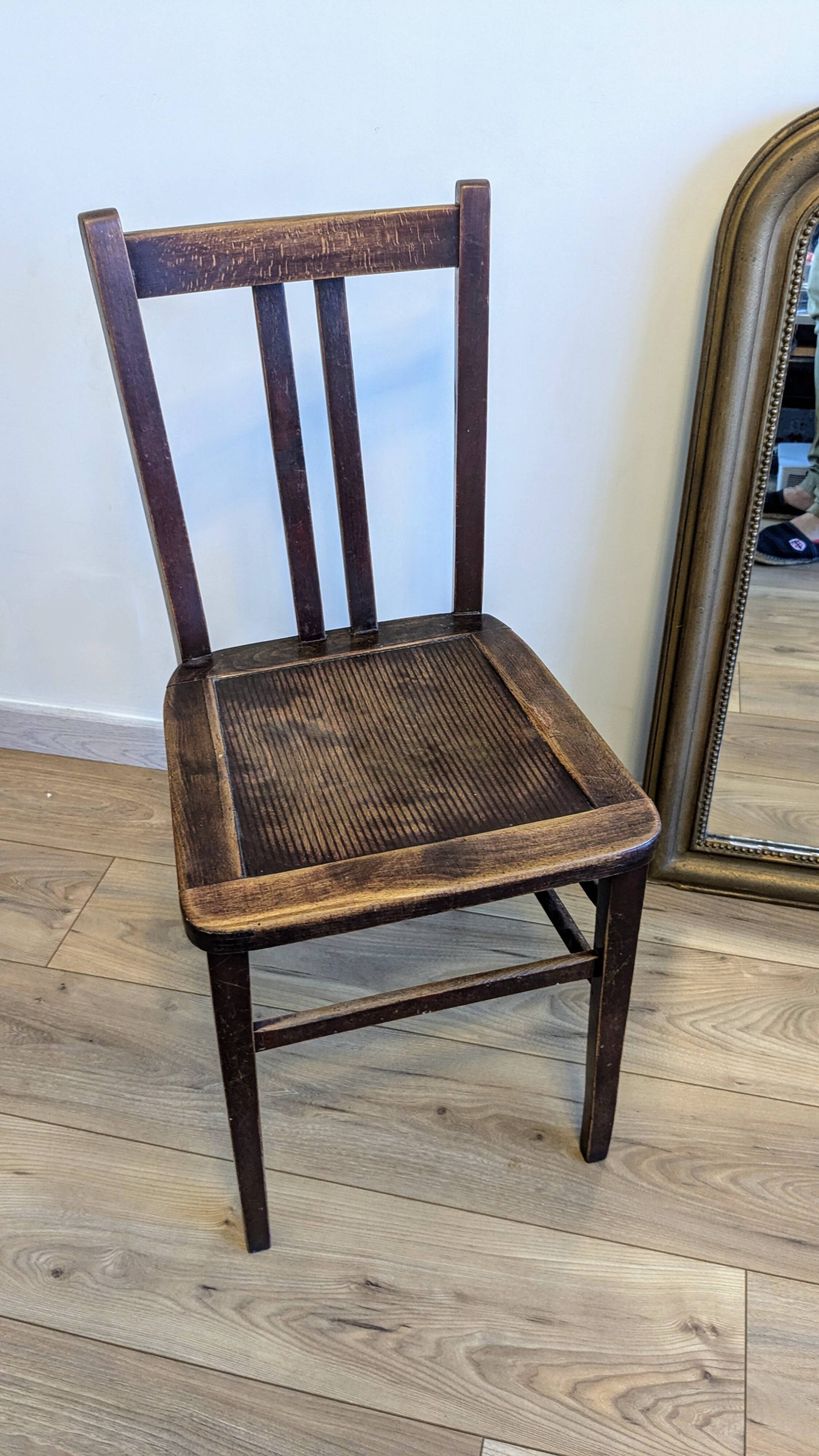 Pair of 1930s bistro chairs with patinated wood.