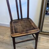 Pair of 1930s bistro chairs with patinated wood.