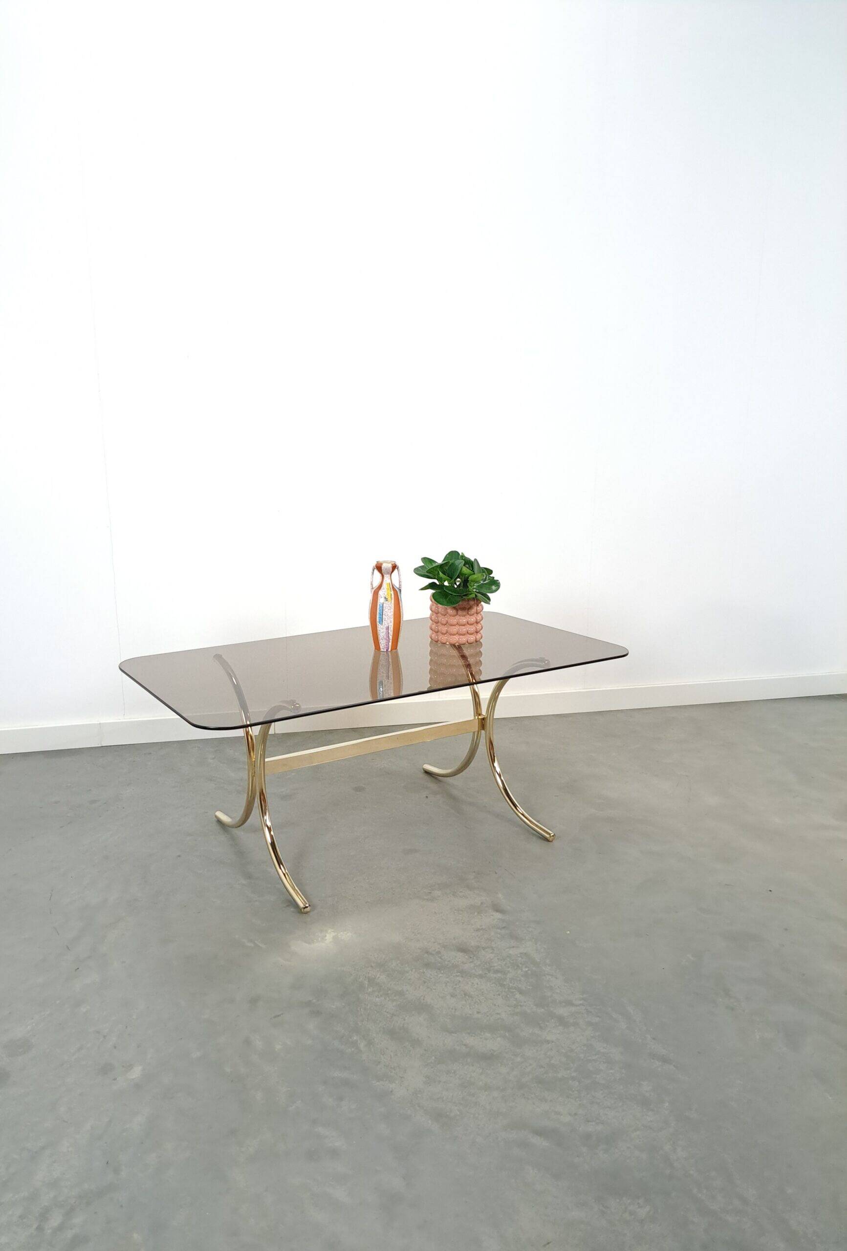 Smoked glass coffee table with gold-coloured legs from Sweden