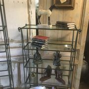 Pair of wrought iron and glass bookshelf shelves.