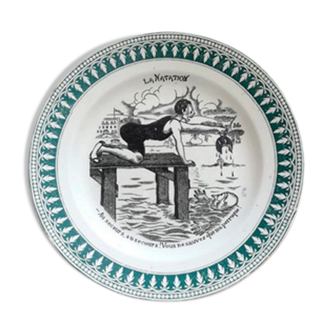 Old vintage dessert plate with drawing and phrase "swimming"