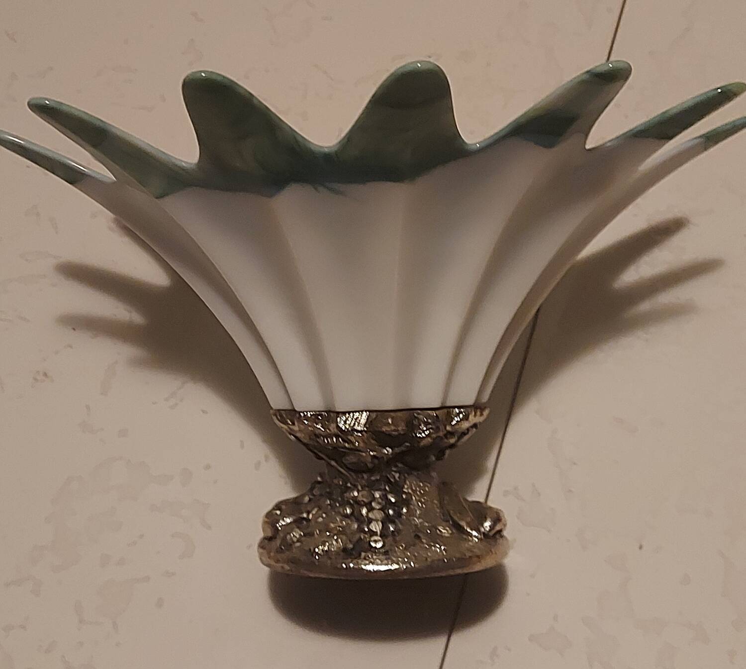 Opalescent glass bowl in the Murano style with a silver-plated metal base.
