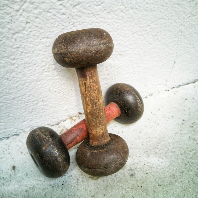 Pair of vintage dumbbells in cast iron and wood