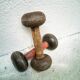 Pair of vintage dumbbells in cast iron and wood