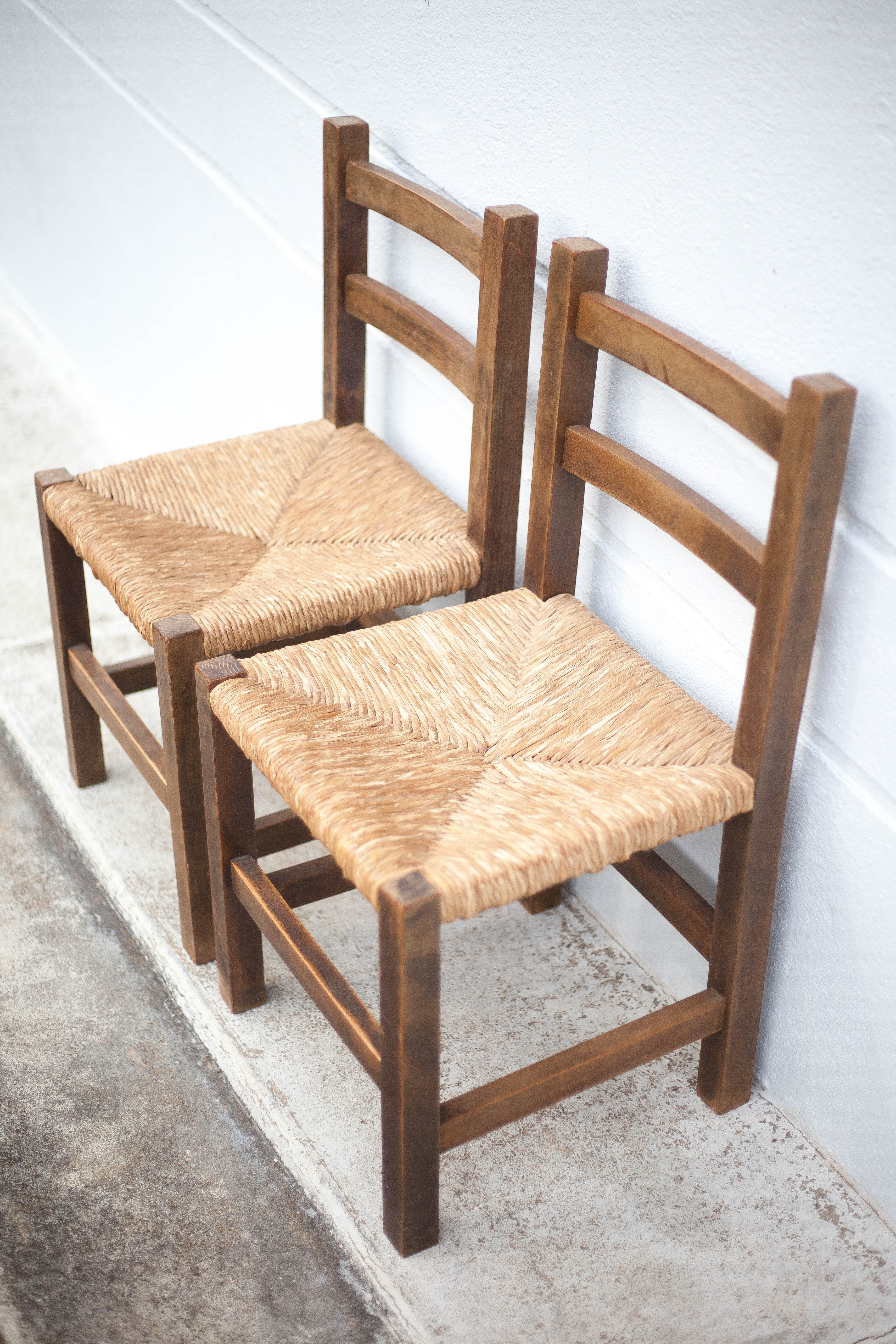 Pair of wooden and straw chairs