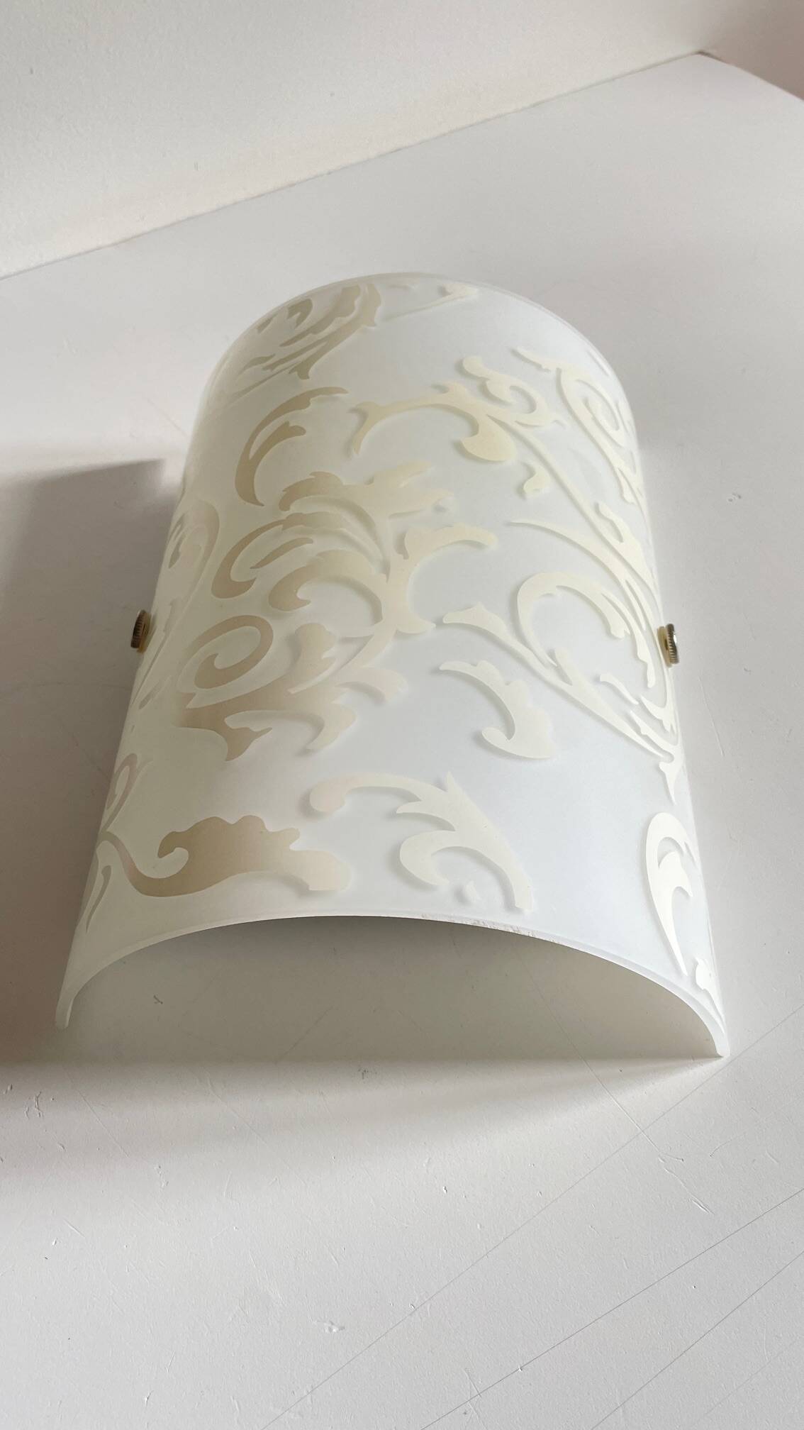 Polished and screen-printed glass sconce by eglo