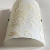 Polished and screen-printed glass sconce by eglo
