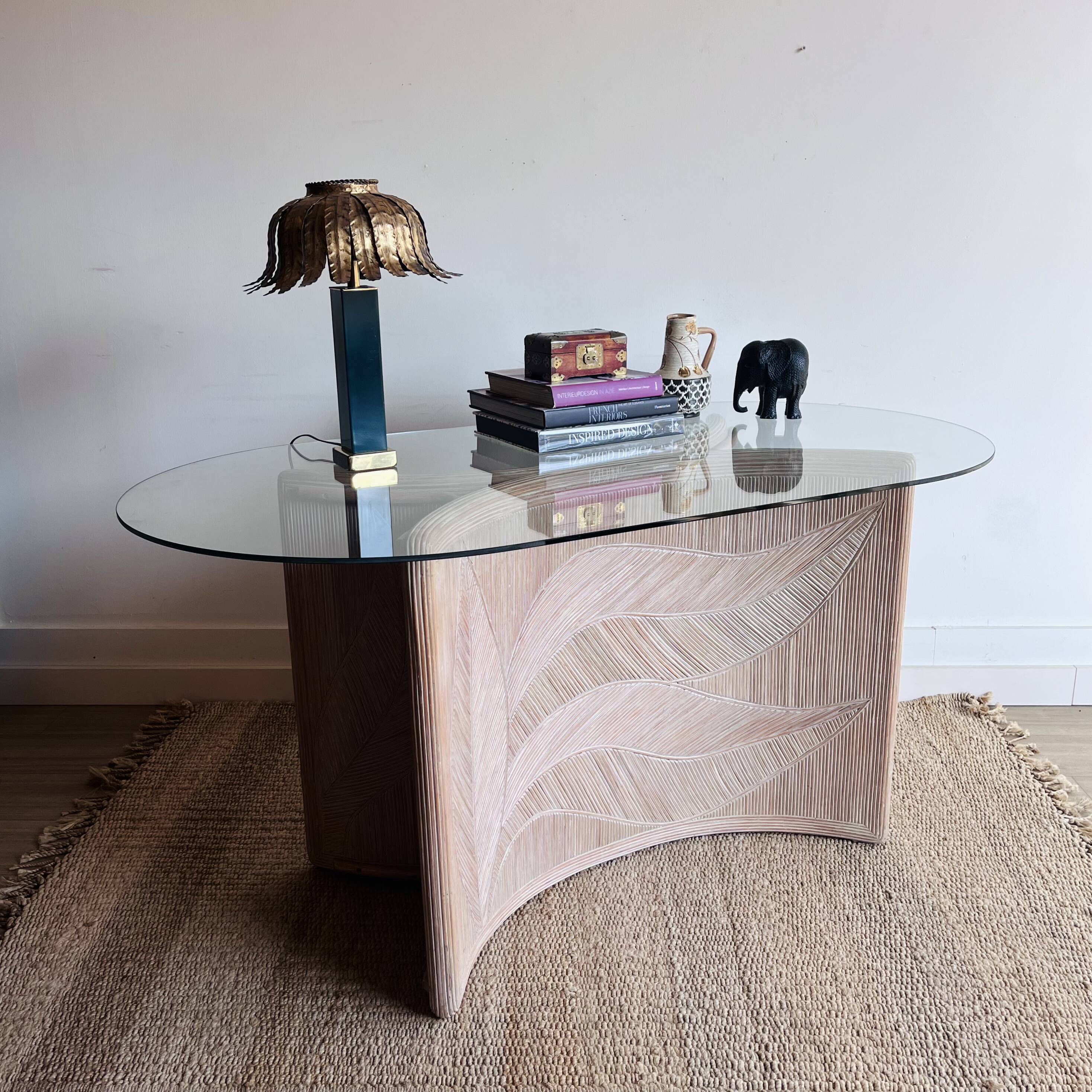 Italian side table with carved rattan and glass top.