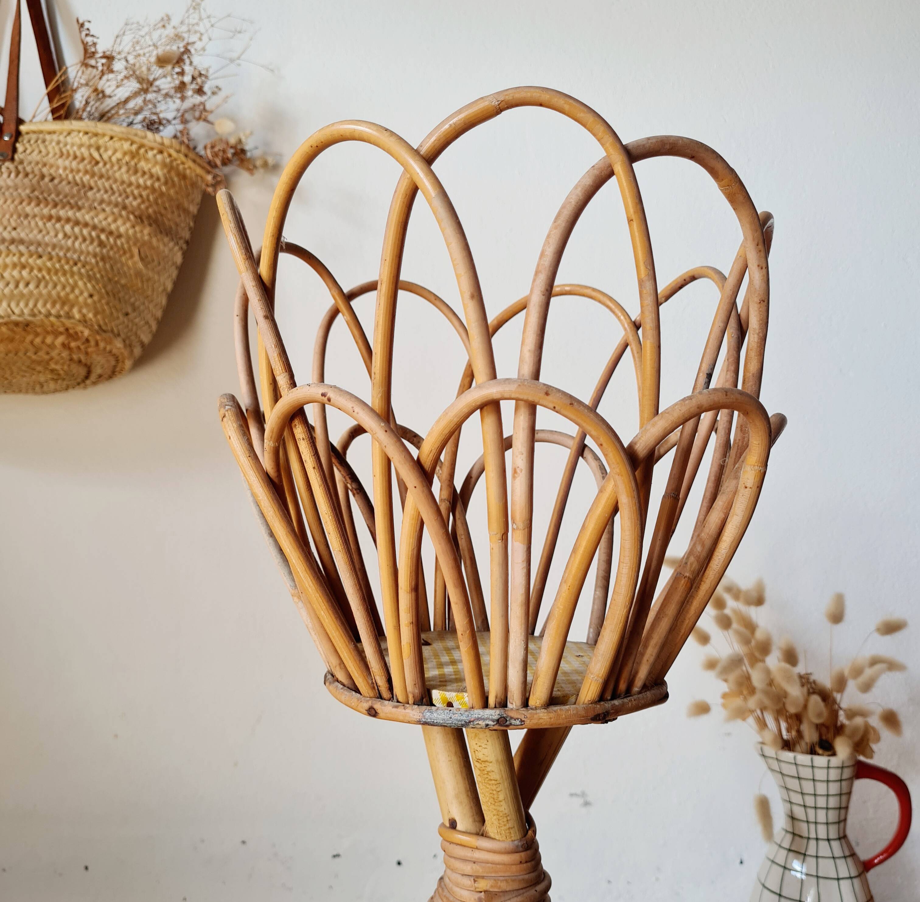Pair of vintage rattan "Diabolo" plant stands from the 1960s.