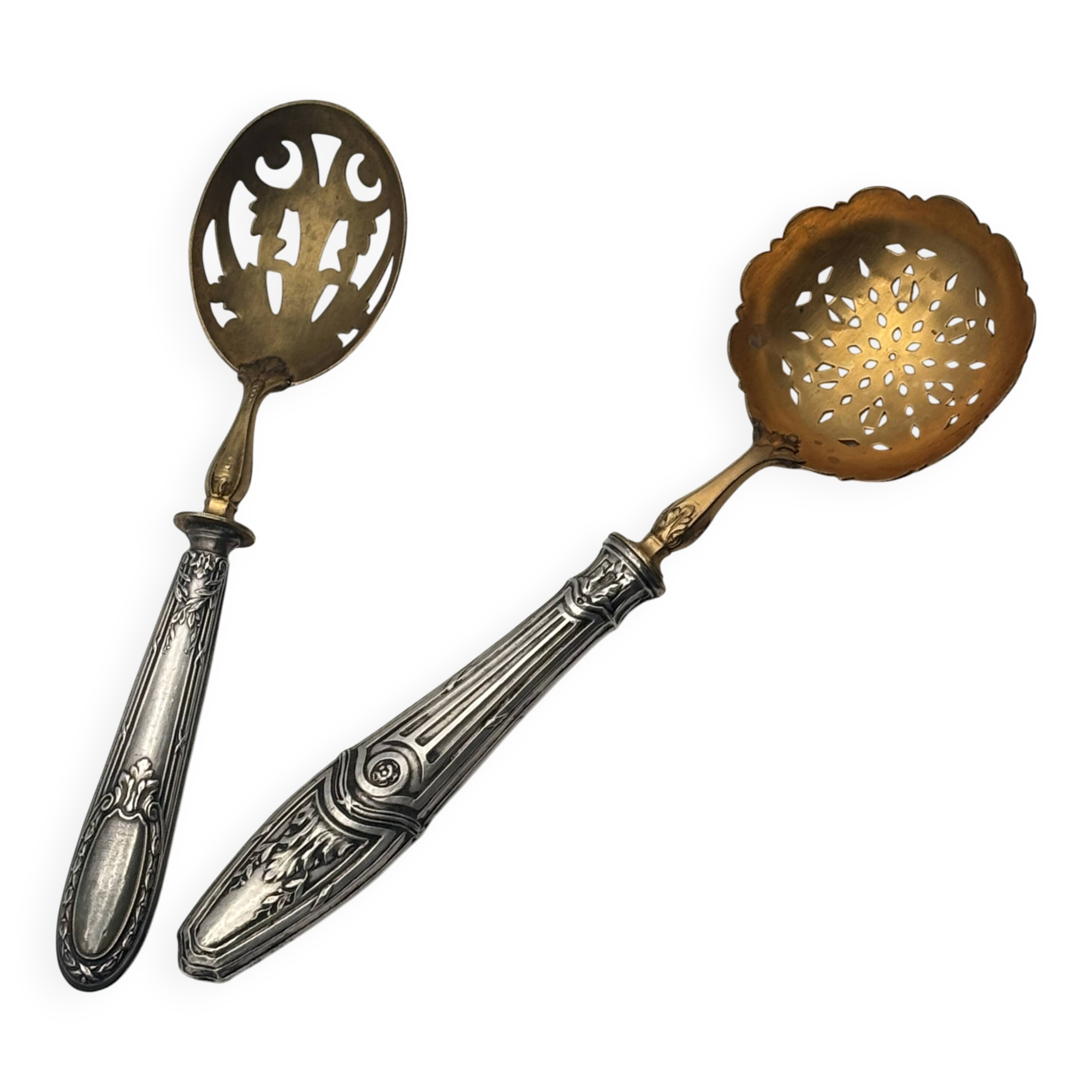 Pair of silver Minerva and vermeil shakers, 19th century.