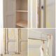 Small antique wardrobe patinated in beige and yellow.