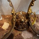 Pair of Louis XV style wall sconces in gilded bronze with glass pendants.