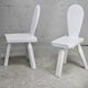 Pair of tripod chairs, gouged seats. Brutalist, circa 1960. Painted wood.