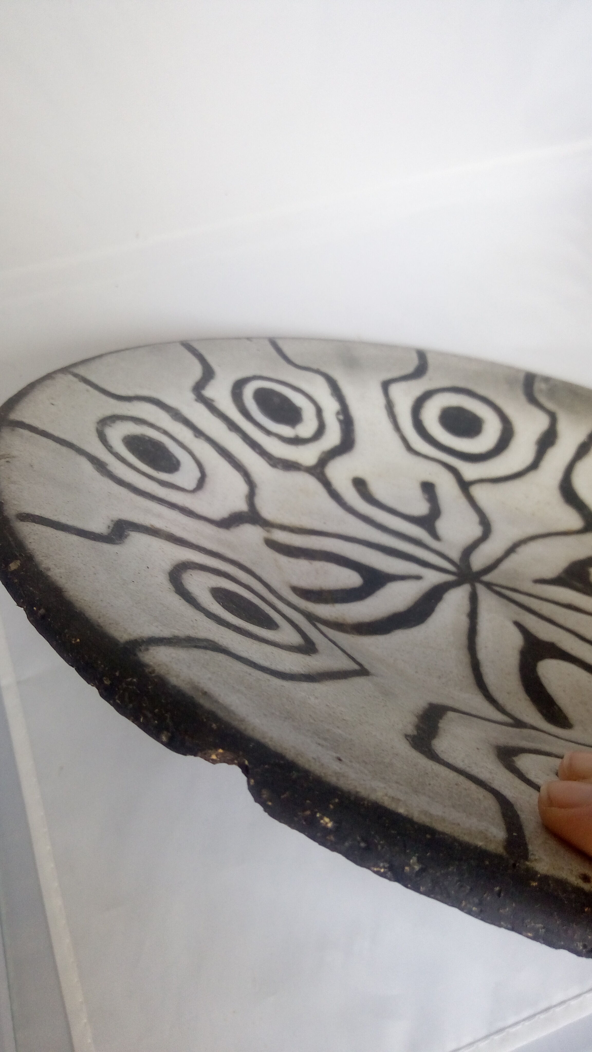 Large black and white brutalist dish