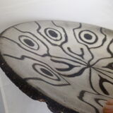 Large black and white brutalist dish