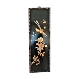 Black lace-up panel patterned with birds and flowering branches in ivory and mother-of-pearl, late 19th century
