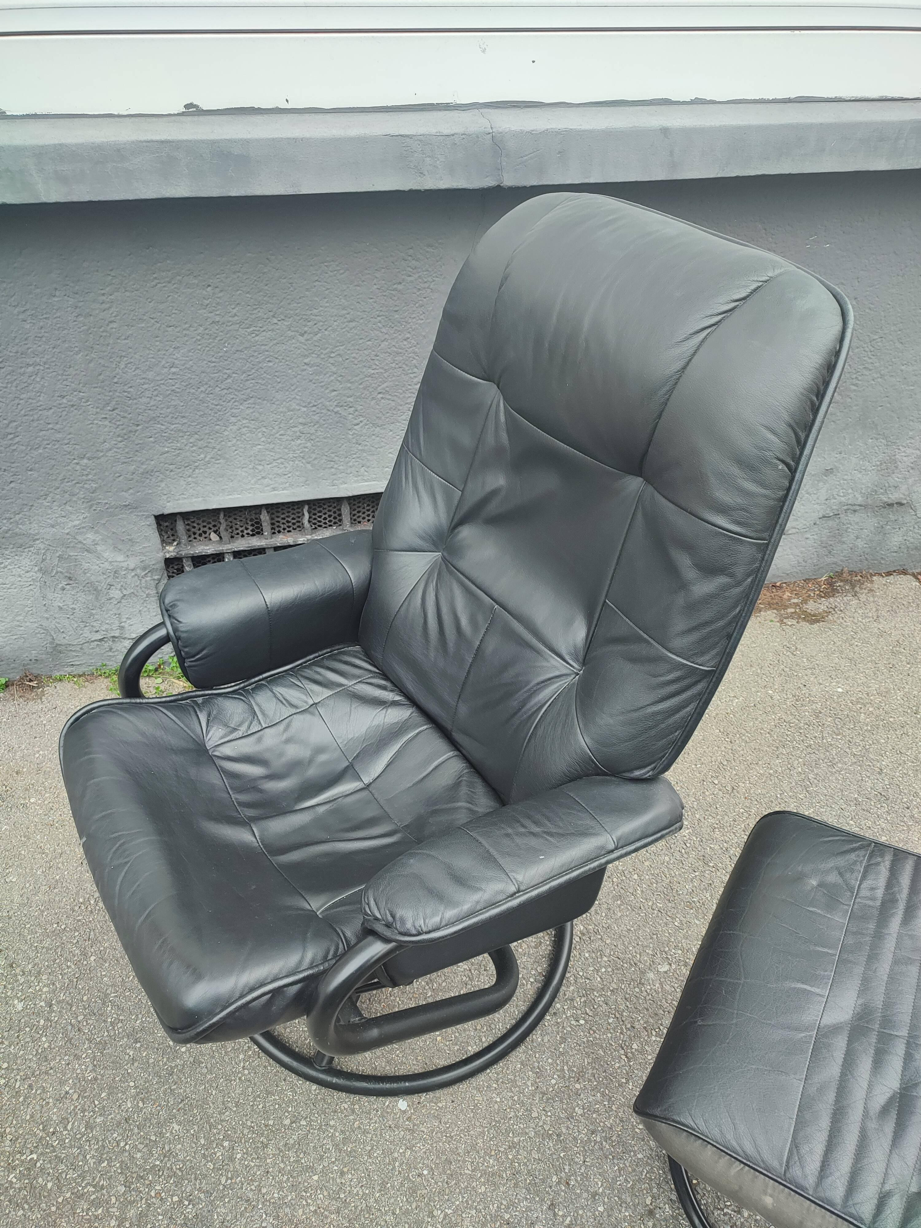 Scandinavian design leather armchair and footrest