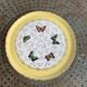 Plat a gateaux, en faïence, jaune avec des papillons muticolores, moulin des loups, orchies nord