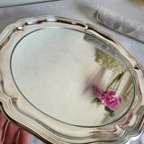Round silver-plated serving dish with a glass base.