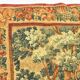 Printed green tapestry depicting birds in the park of a castle
