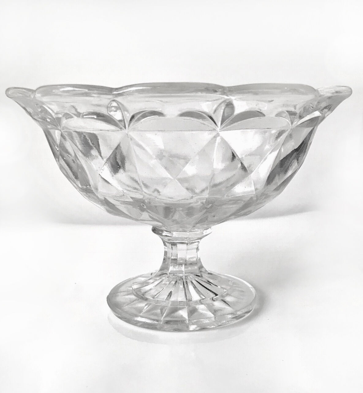 Old cut on foot faceted glass