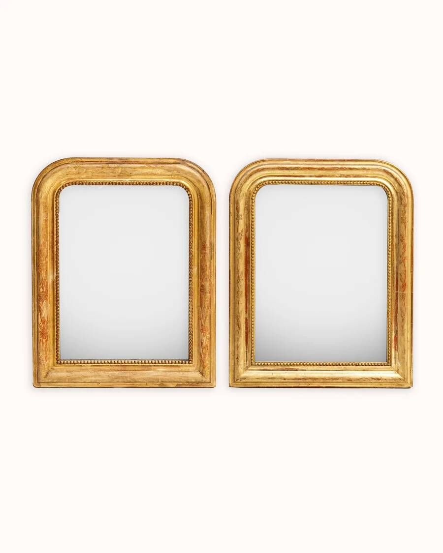 Set of two small French Louis-Philippe gilt red mirrors from the 19th century.