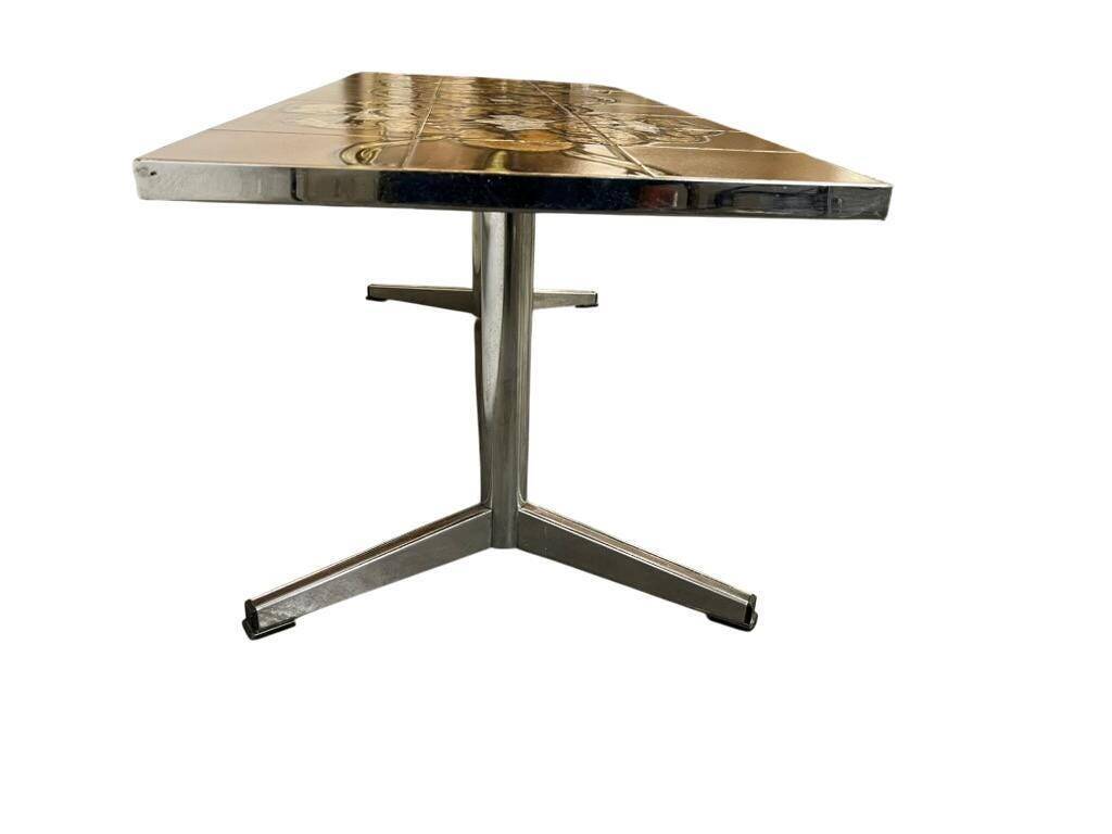 Vintage ceramic coffee table with a chrome frame.