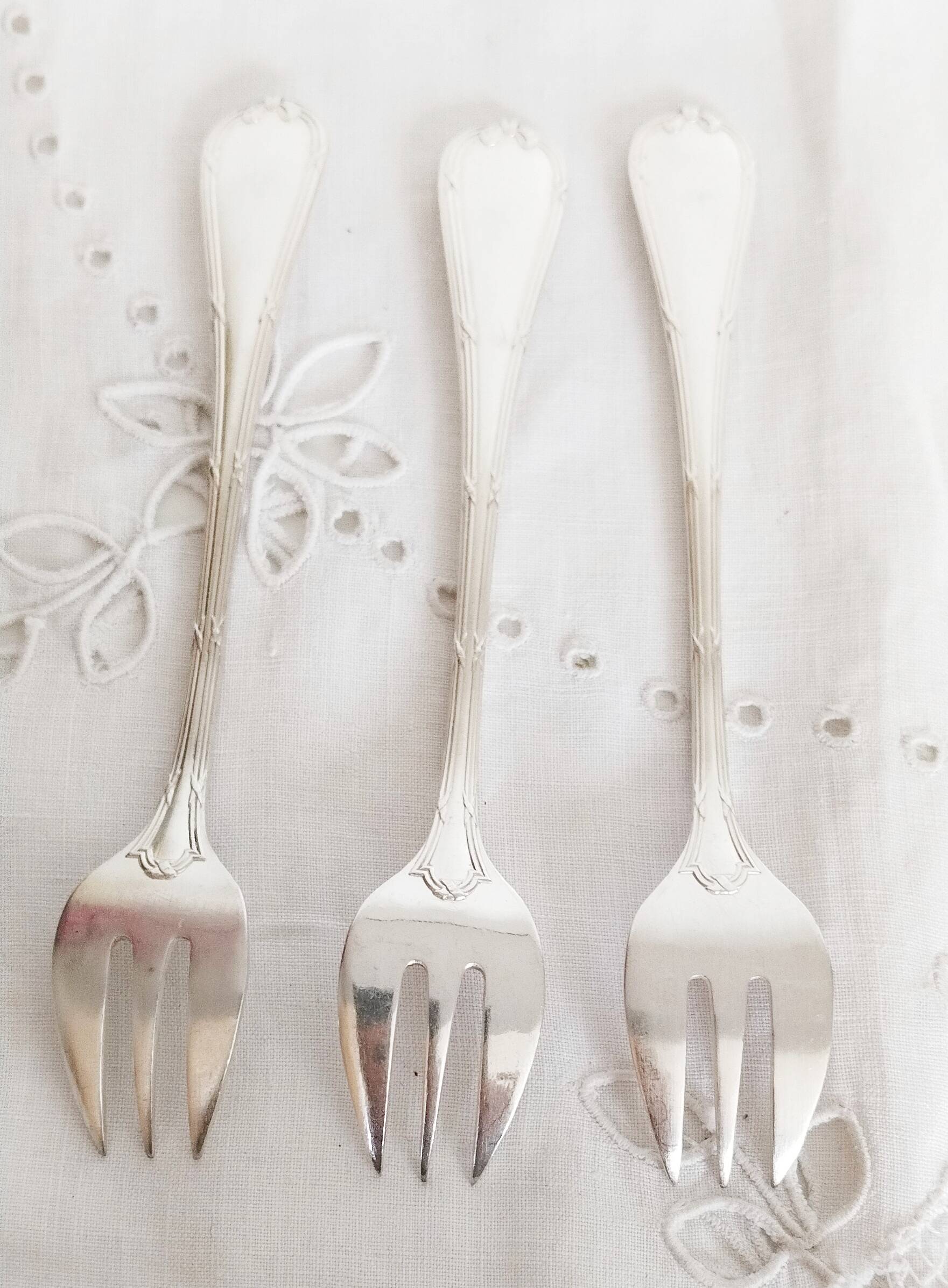 Christofle oyster or dessert forks, ribbon pattern, silver