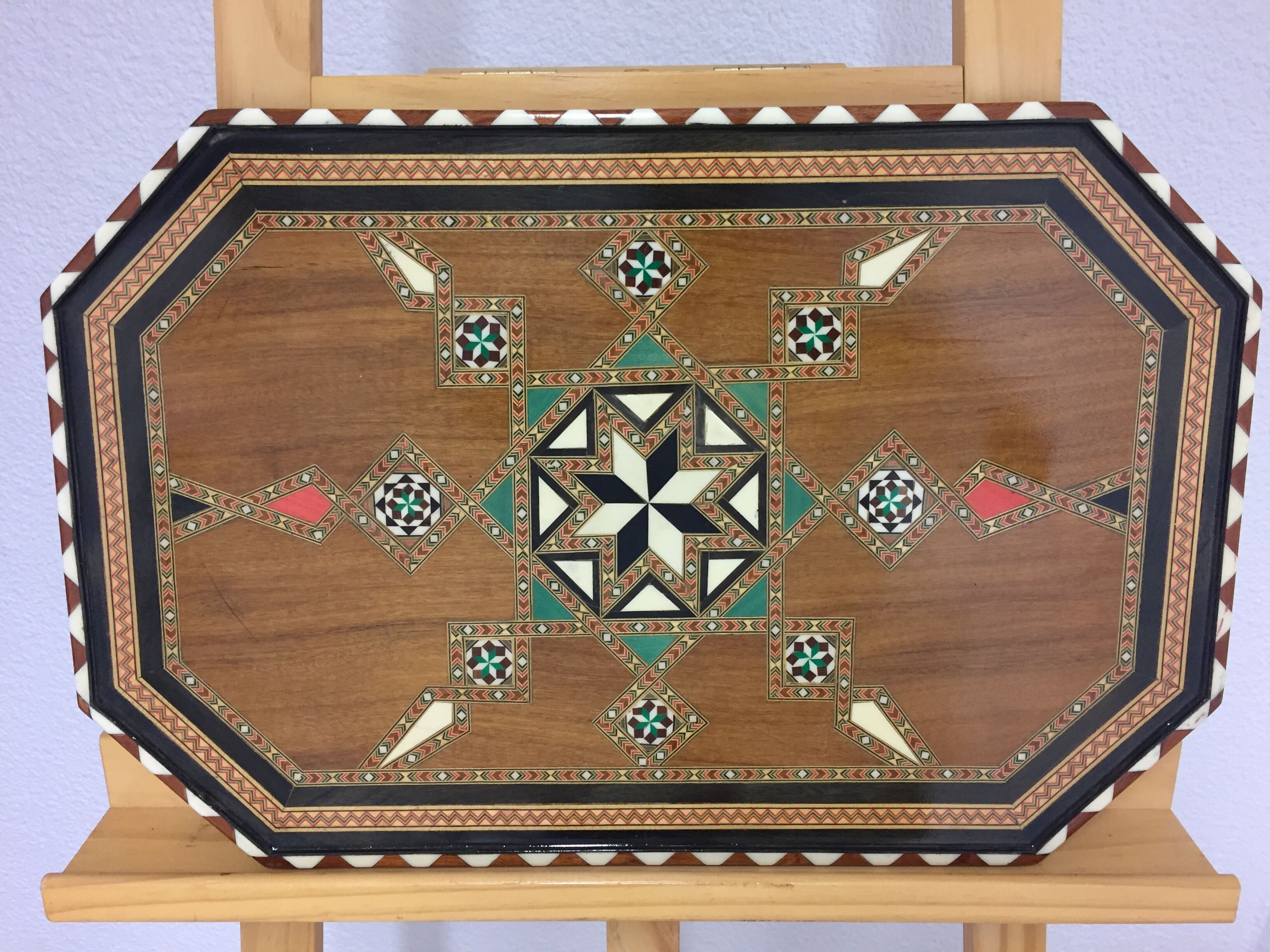 Old geometric marquetry top design'