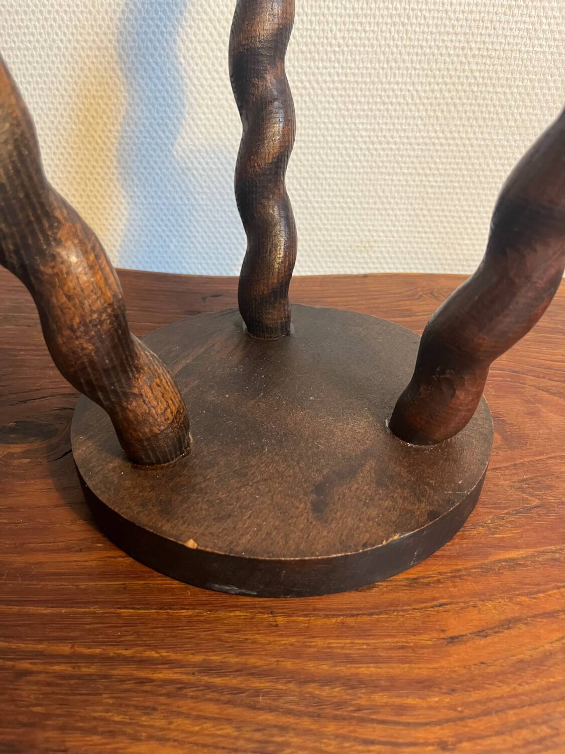 Round wooden tripod stool