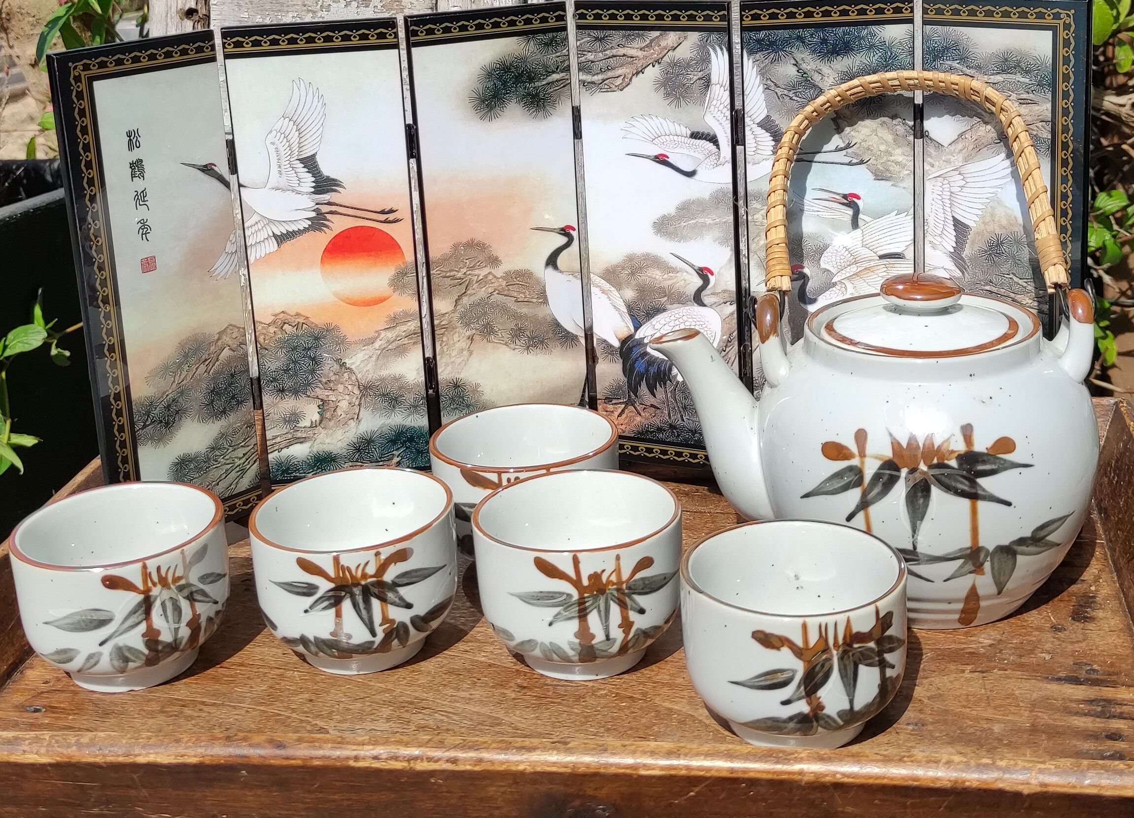 Asian set of a teapot and its cups