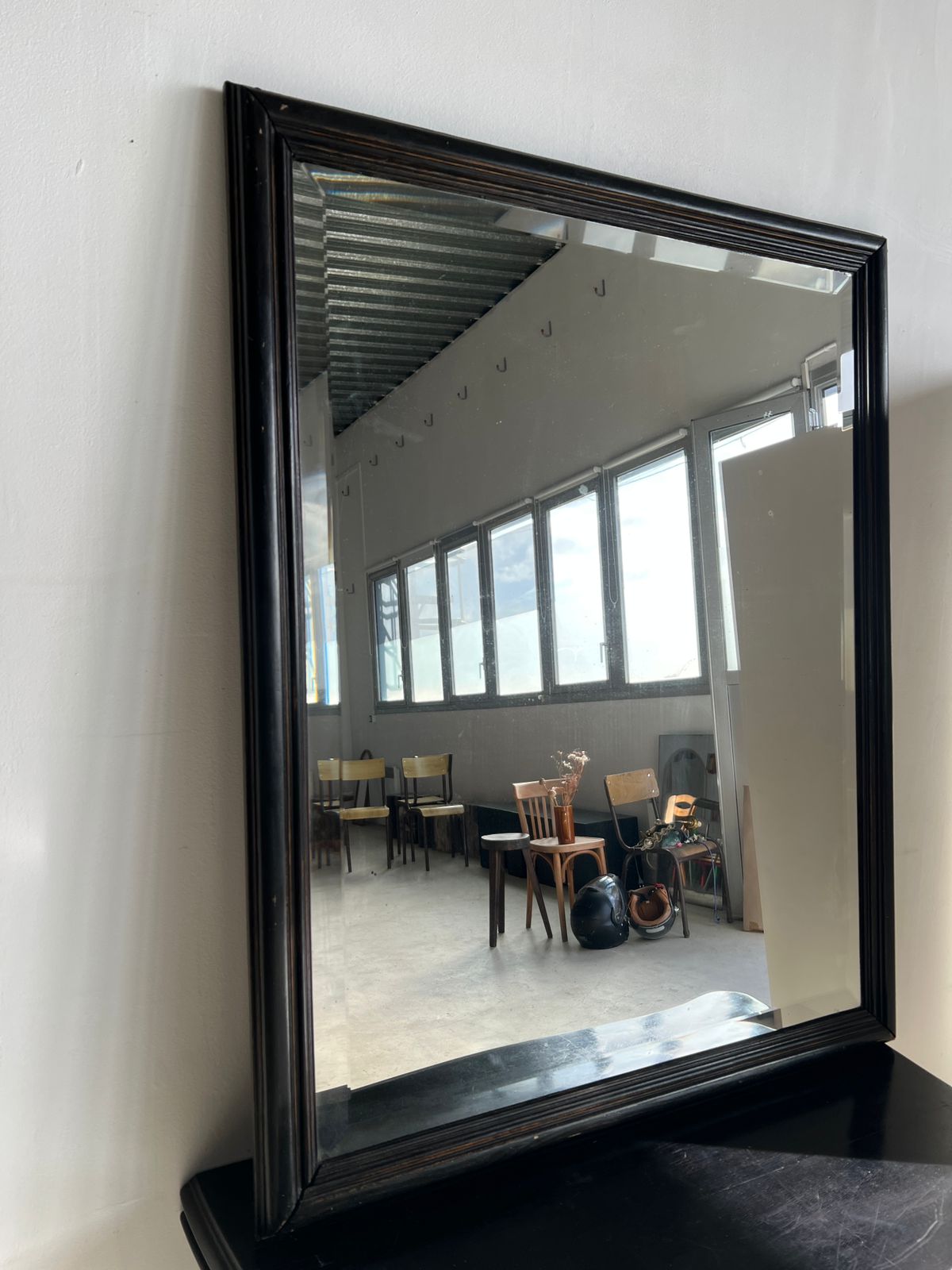 Rectangular mirror in molded blackened wood, beveled glass